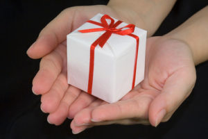 hands holding small gift box